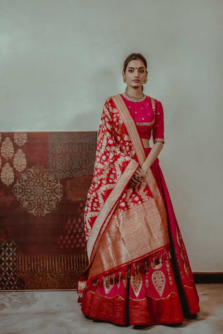 RUBY RED LEHENGA SET WITH ALL OVER SELF EMBROIDERY PAIRED WITH A MATCHING  DUPATTA AND FRILL DETAILS. - Seasons India